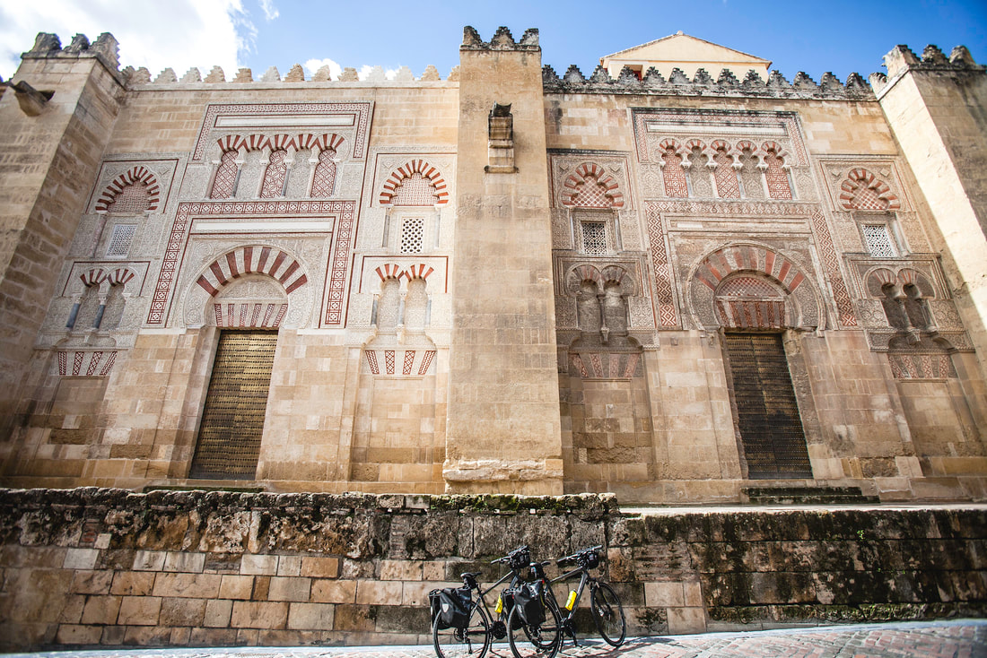 Bicycles parked outside the walls of the Catherdral Mosque of Cordoba in Andalucia in southern Spain