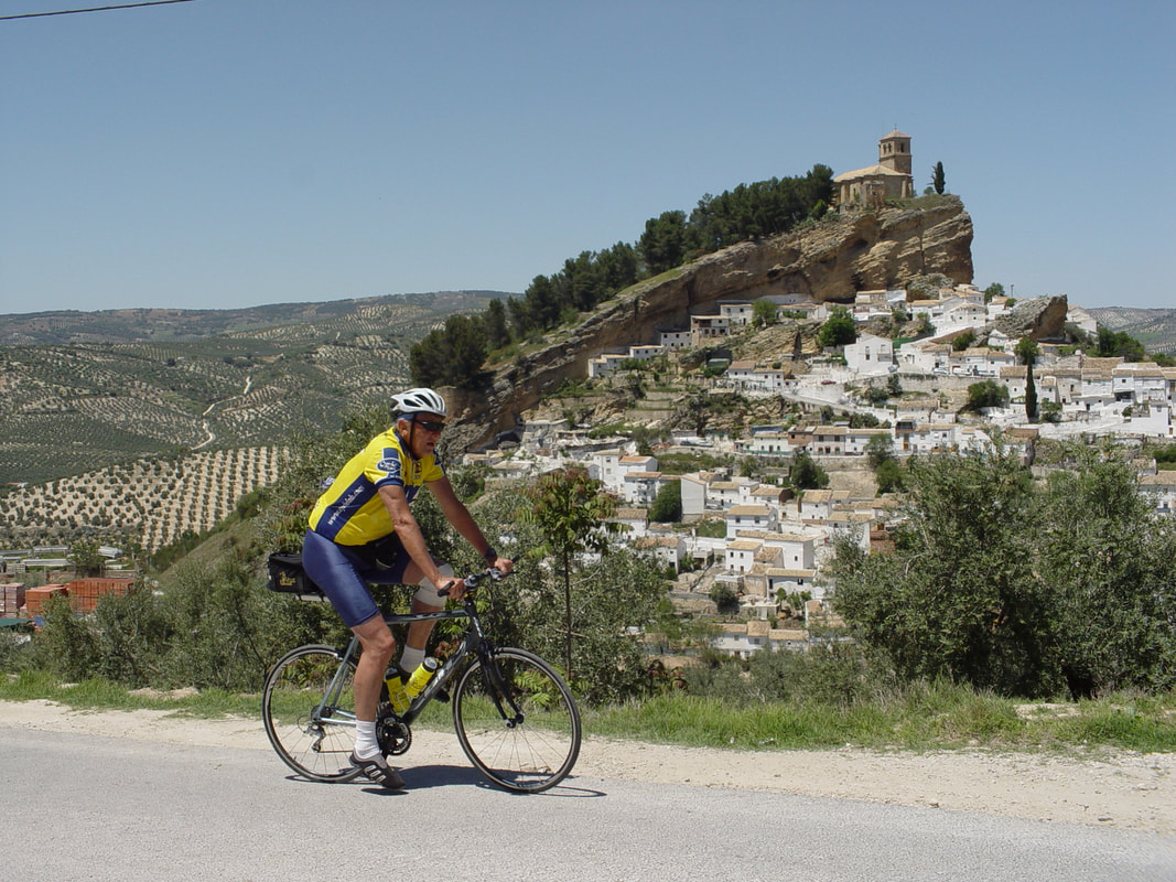 Cyclist climbing in Montefrio in Andalucia in Spain